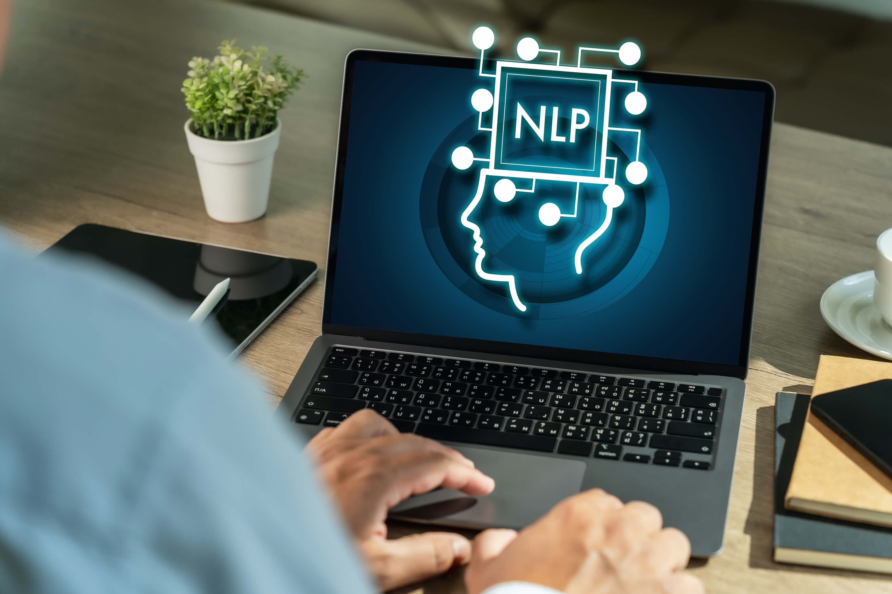 NLP graphic on a laptop